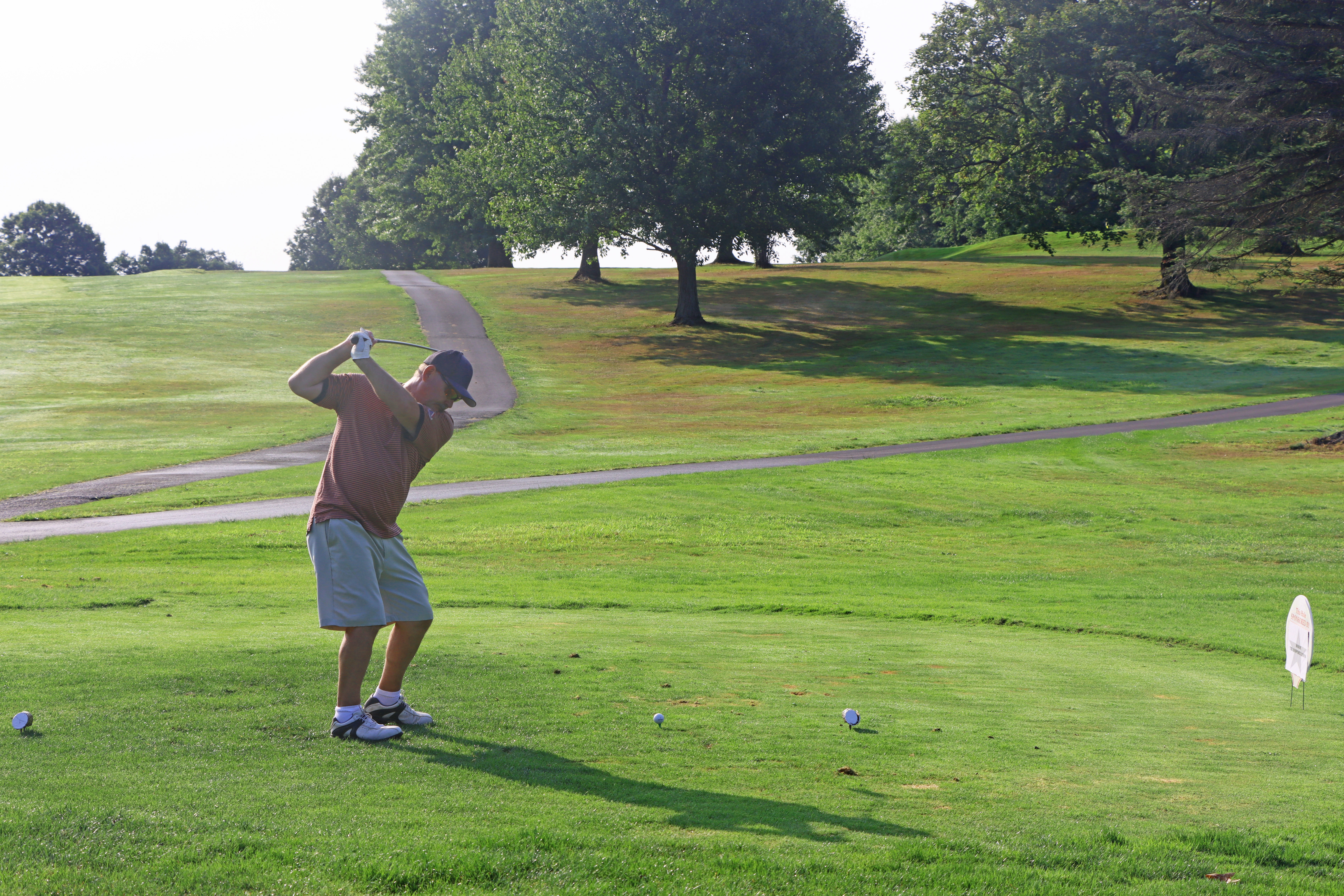 A gentlman teeing off