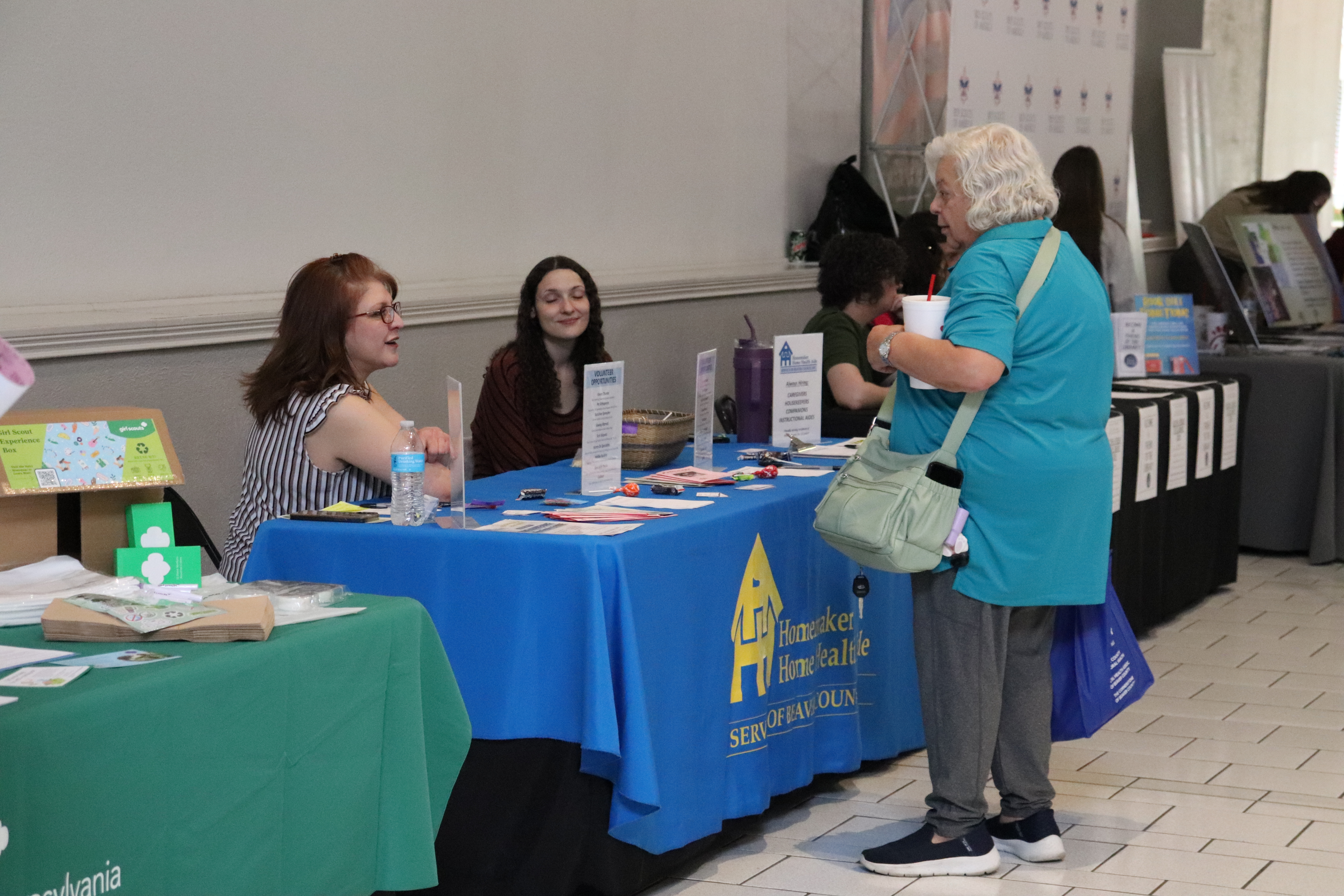 A woemn at teh Homemaker Home Health Aide Table