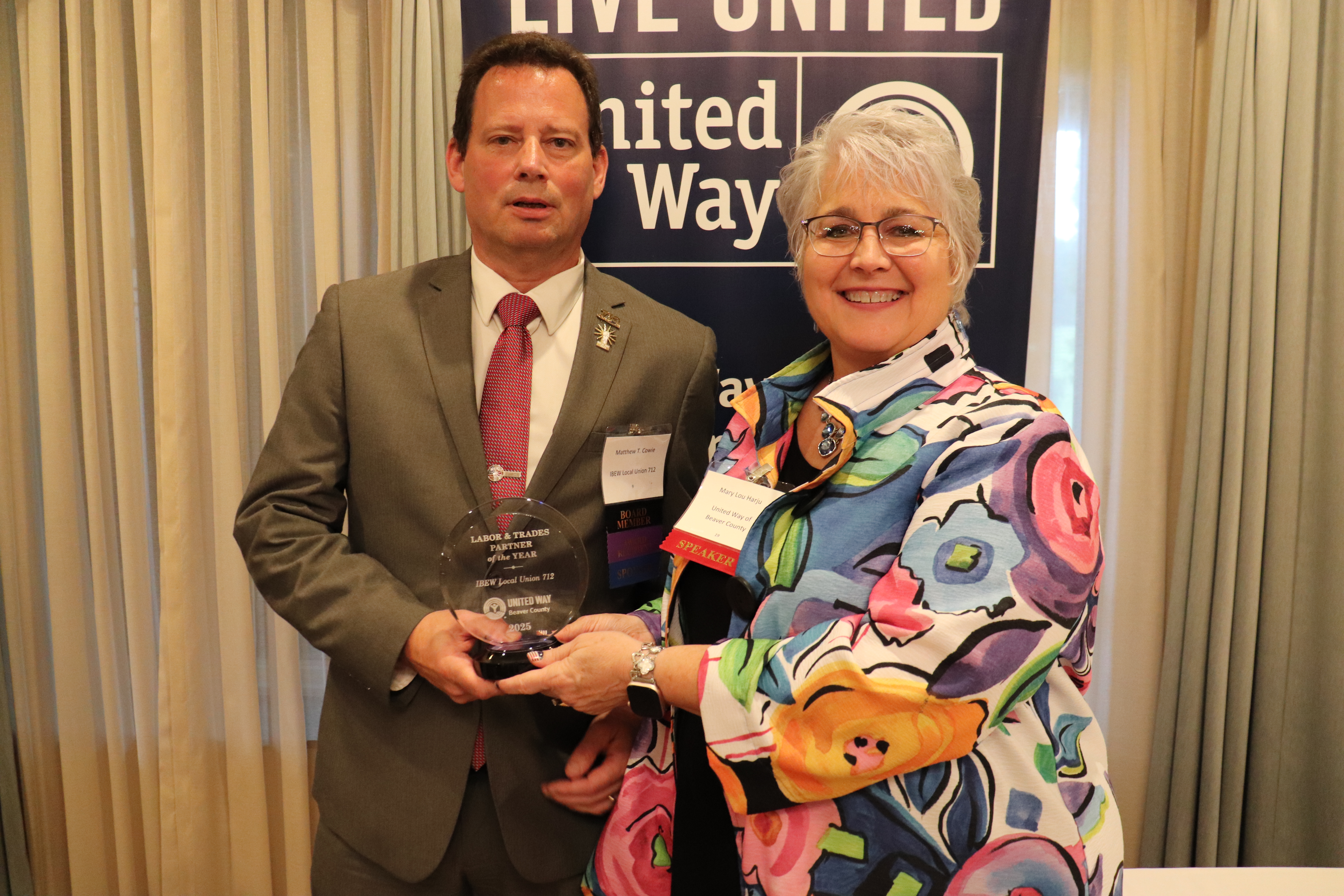 Matthew Cowie accepting the LAbor and Trades Award for IBEW Local Union #712